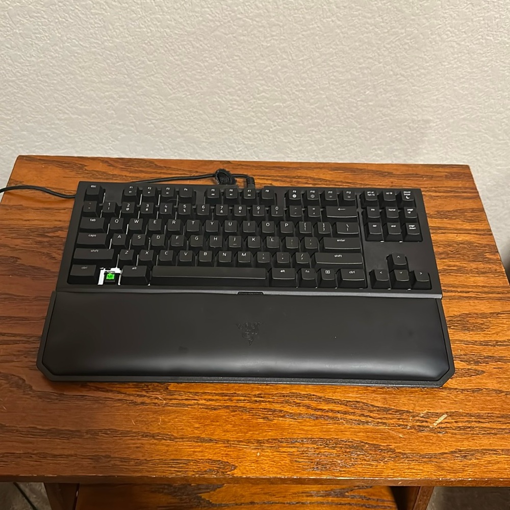 Gaming razer keyboard ergonomic wrist rest included.